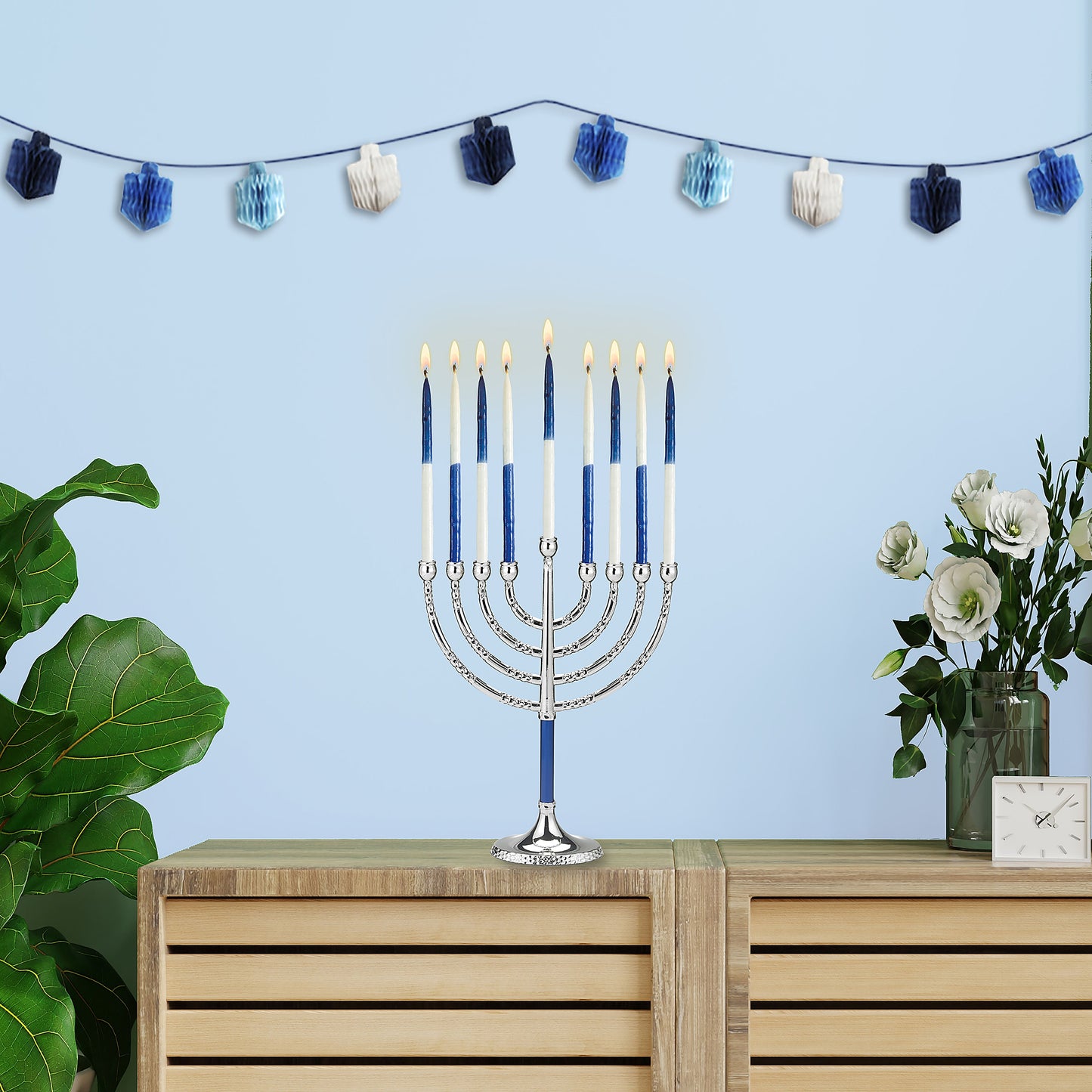 Hanukkiah with two-tone blue and white candles lit