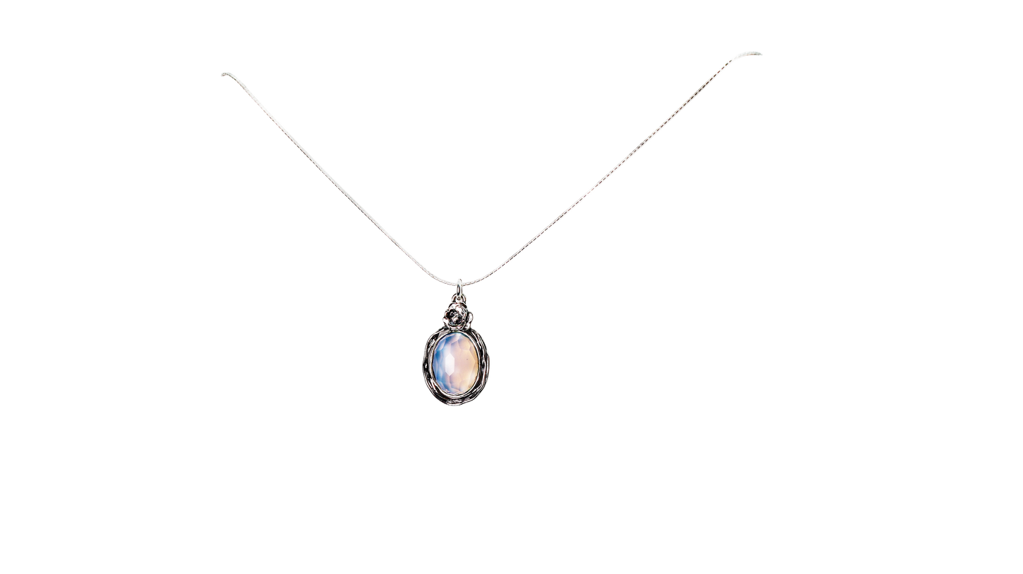 Selenite Stone Oval Necklace with Silver flower at top of pendant, on a silver chain