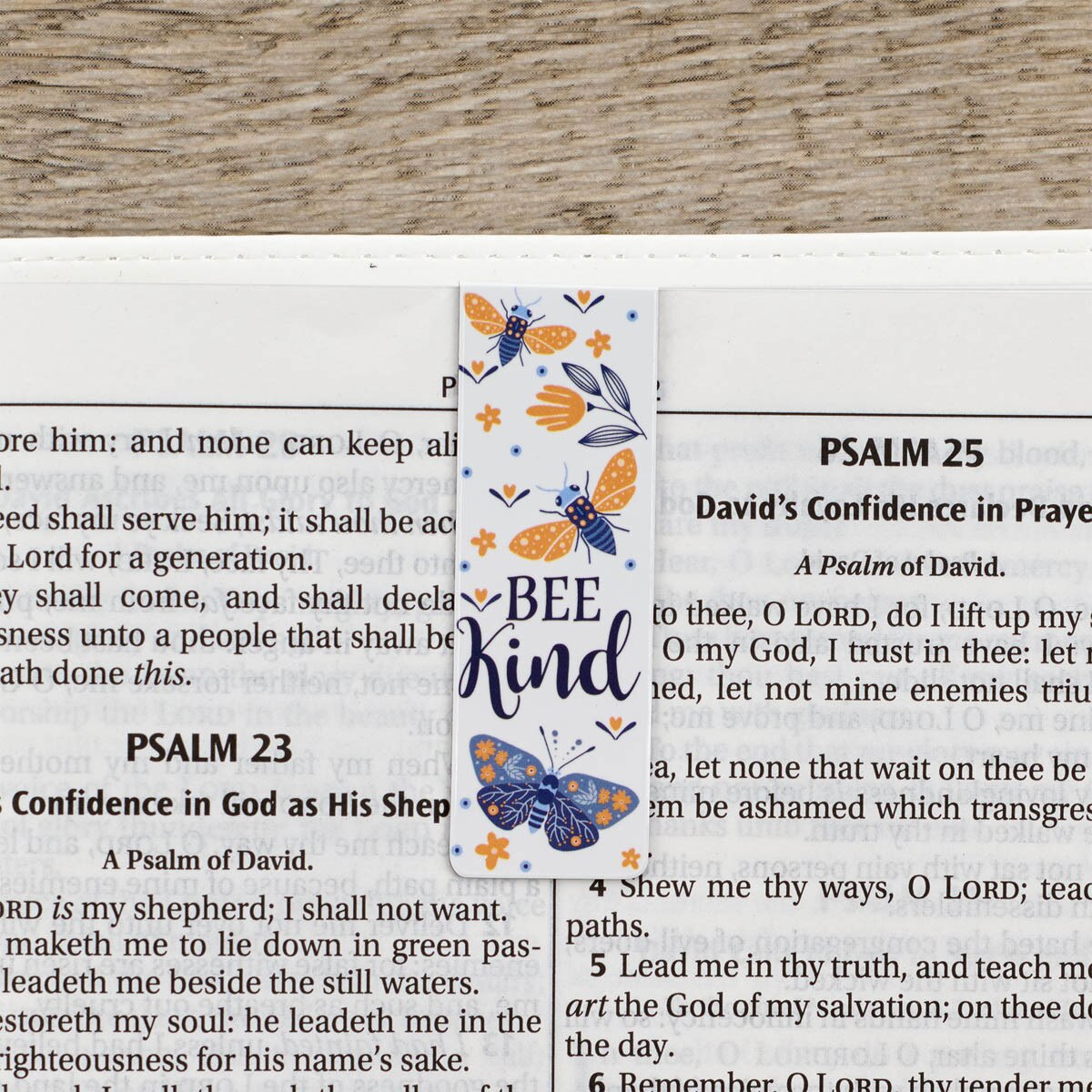 One of the bookmarks from the Let It Bee Magnetic Bookmark Set displayed in a Bible