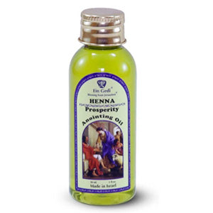 A bottle of Henna Prosperity Anointing Oil with a gold colored cap