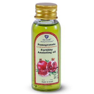A bottle of Pomegranate Fertility Anointing Oil with a label featuring images of pomegranates. The cap is gold, and the bottle is set against a white background.
