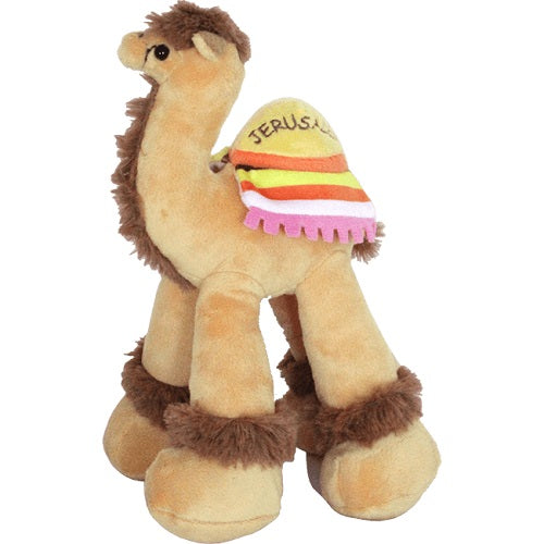 A cute plush brown camel with a colorful blanket on its hump