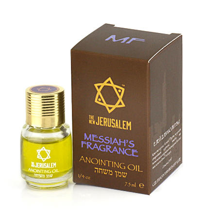 A product image featuring a small bottle of anointing oil next to its packaging box, with the branding 'The New Jerusalem' and 'Messiah's Fragrance'. The box has a Star of David emblem .