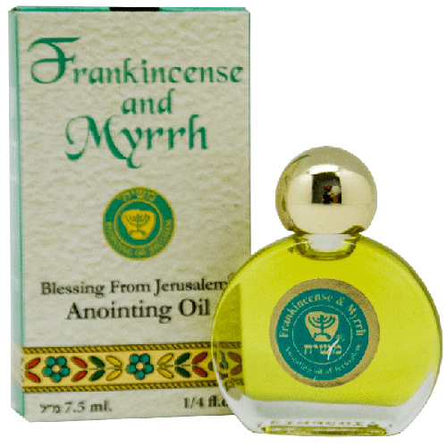 A bottle of Ein Gedi Frankincense and Myrrh anointing oil with its packaging box. The bottle is circular and clear with a gold-colored cap