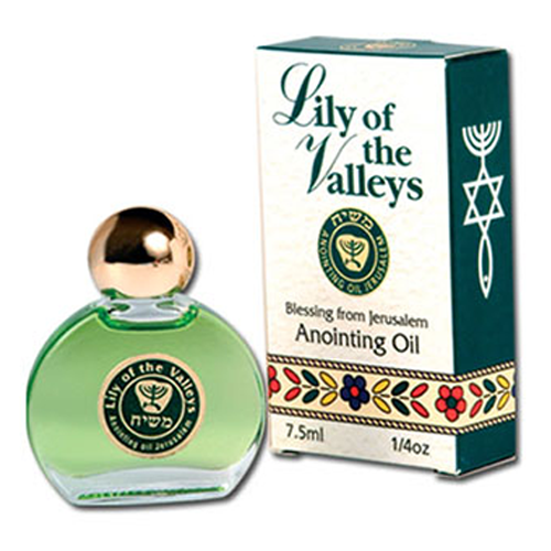 A bottle of Ein Gedi Lily of the Valley Anointing Oil with its packaging box. The bottle is clear and circular, featuring a gold-colored cap.