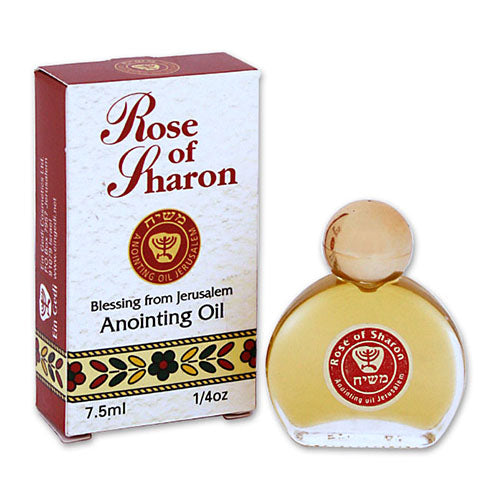 A bottle of Ein Gedi Rose of Sharon Anointing Oil with its packaging box. The bottle is clear and circular, featuring a gold-colored cap.