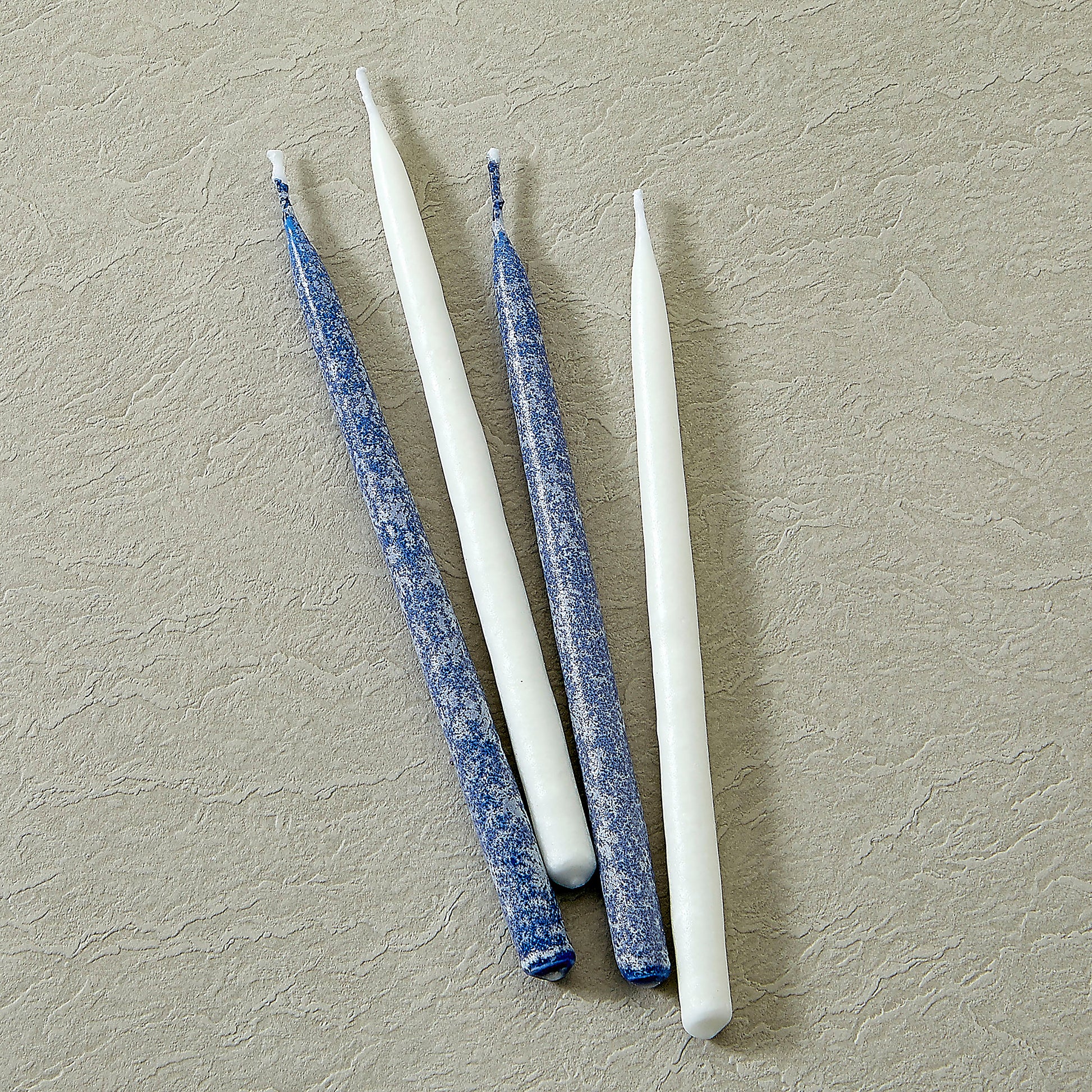 Close up of frosted Blue and White Candles