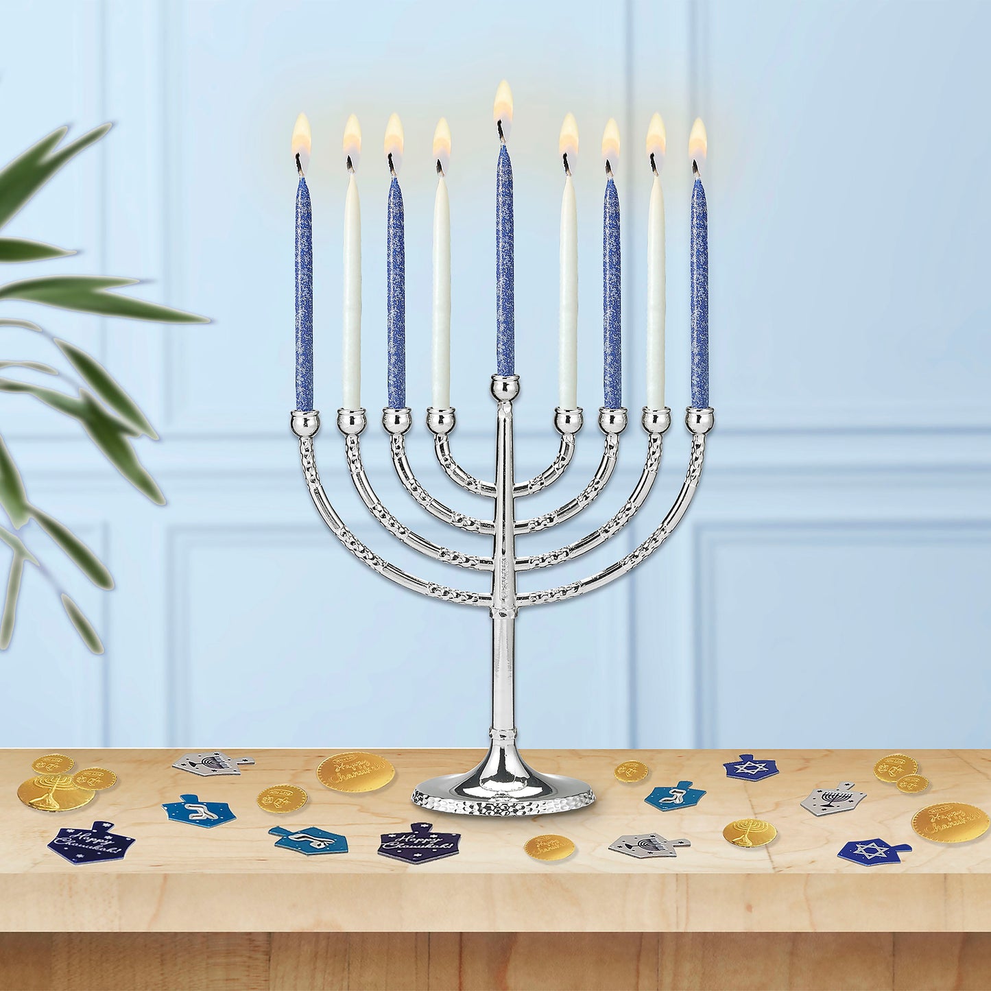 Box of frosted Blue and White Candles burning in a Hanukkiah