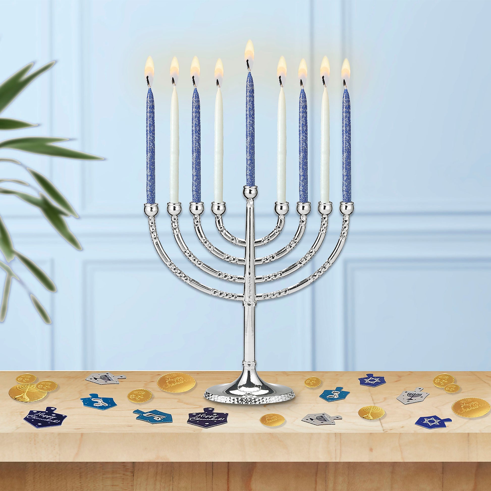 Box of frosted Blue and White Candles burning in a Hanukkiah
