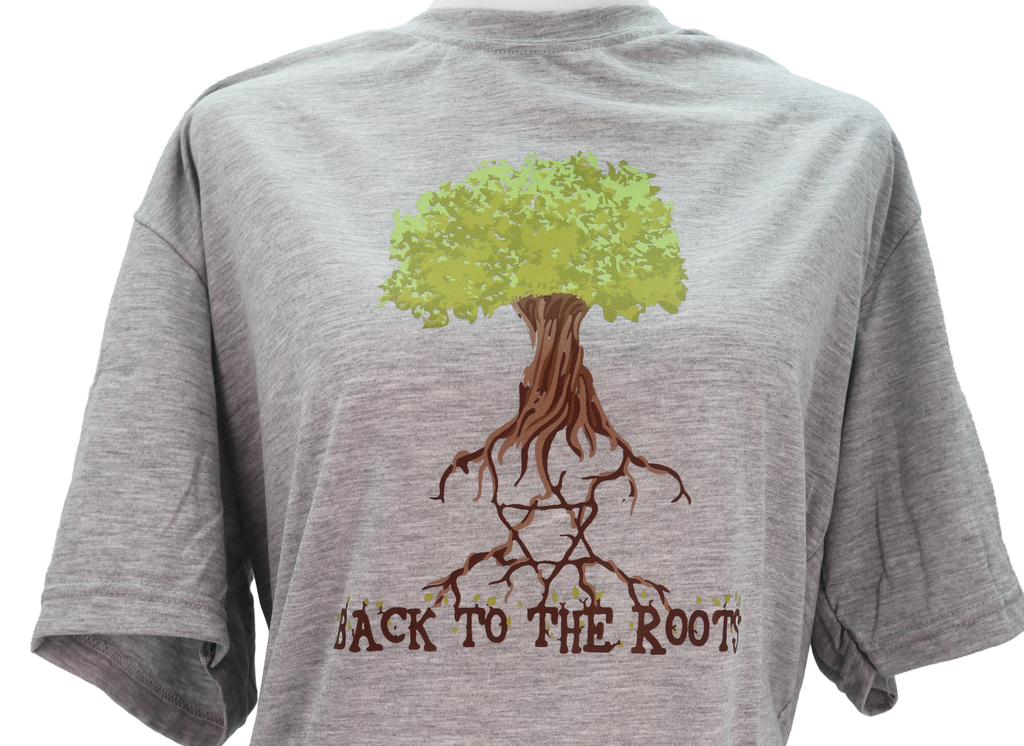 Close up of gray T-shirt with a tree that has the star of David in the roots and the phrase back to the roots underneath