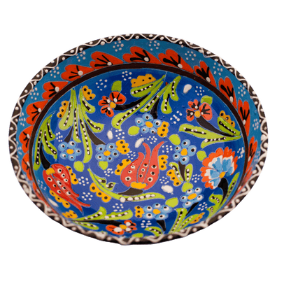 Light blue ceramic bowl with a multicolored floral design