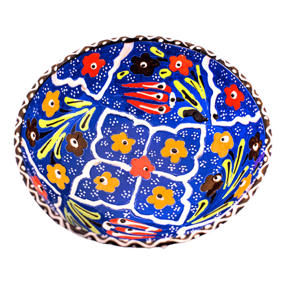 Blue ceramic bowl with a multicolored floral design