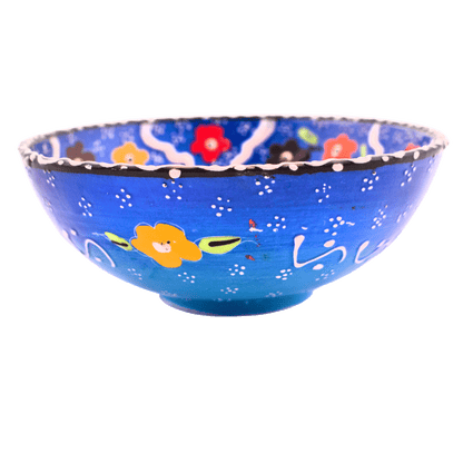 Blue ceramic bowl with a multicolored floral design