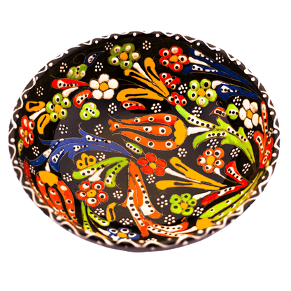 Black ceramic bowl with a multicolored floral design