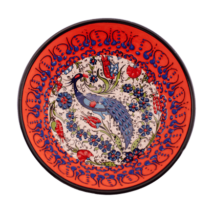 Handmade orange Middle Eastern-style ceramic bowl with an intricate floral and peacock design