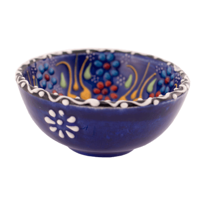 Handmade navy blue ceramic bowl with a multicolored floral design