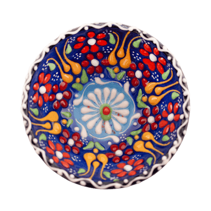 Handmade navy blue ceramic bowl with a multicolored floral design