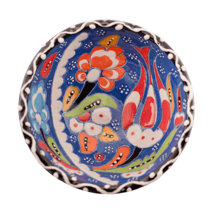 Handmade sapphire blue ceramic bowl with a multicolored floral design