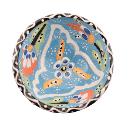 Handmade light blue ceramic bowl with a multicolored floral design