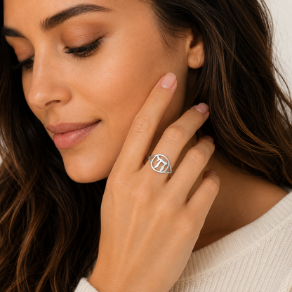 Woman wearing a silver Chai ring with Hebrew symbol design