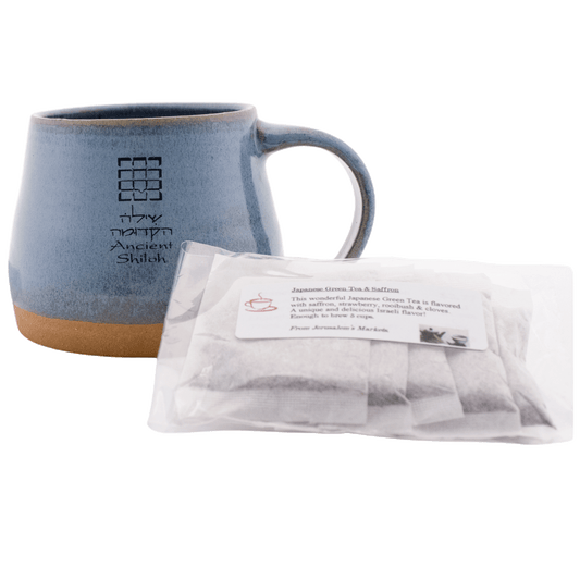 Blue ceramic mug with a 5-pack bag of Japanese green tea