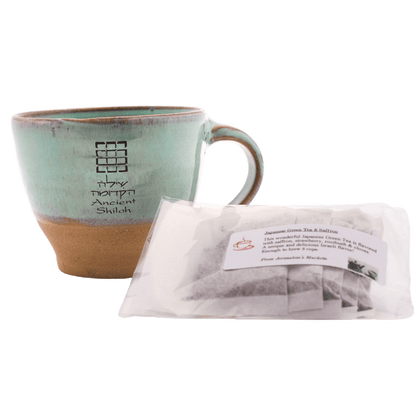 Seafoam-green ceramic mug with a 5-pack bag of Japanese green tea