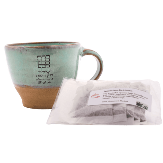 Seafoam-green ceramic mug with a 5-pack bag of Japanese green tea