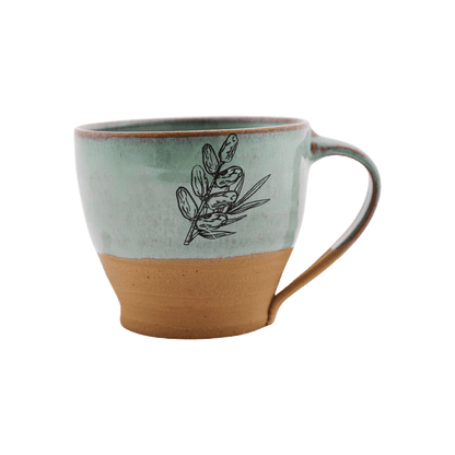 Seafoam-green ceramic mug with a date design on the front