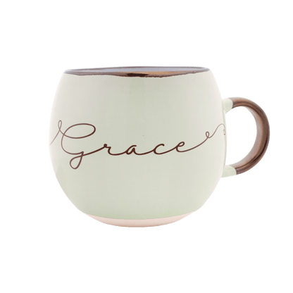 Pastel green  mug with the word "grace" on the front