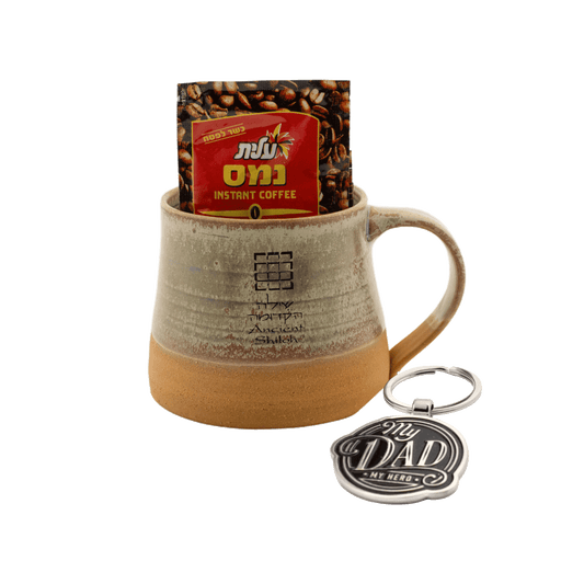 Tan ceramic mug with a keychain and 4 bags of Israeli instant coffee