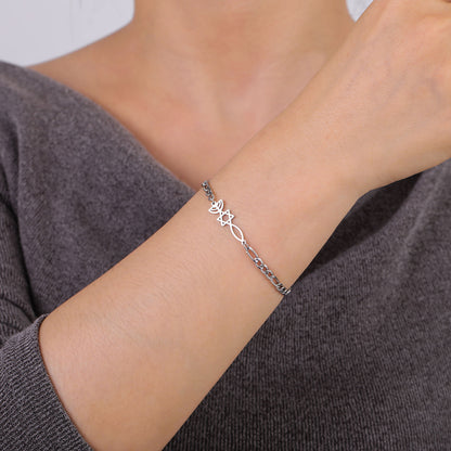 Silver-tone Grafted In bracelet with biblical symbols shown on a woman’s wrist