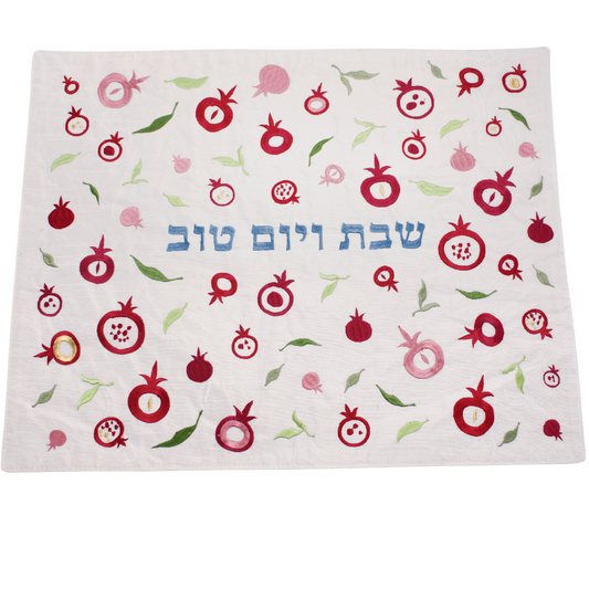 Challah cover with embroidered pomegranates and leaves with blue Hebrew letters in the center