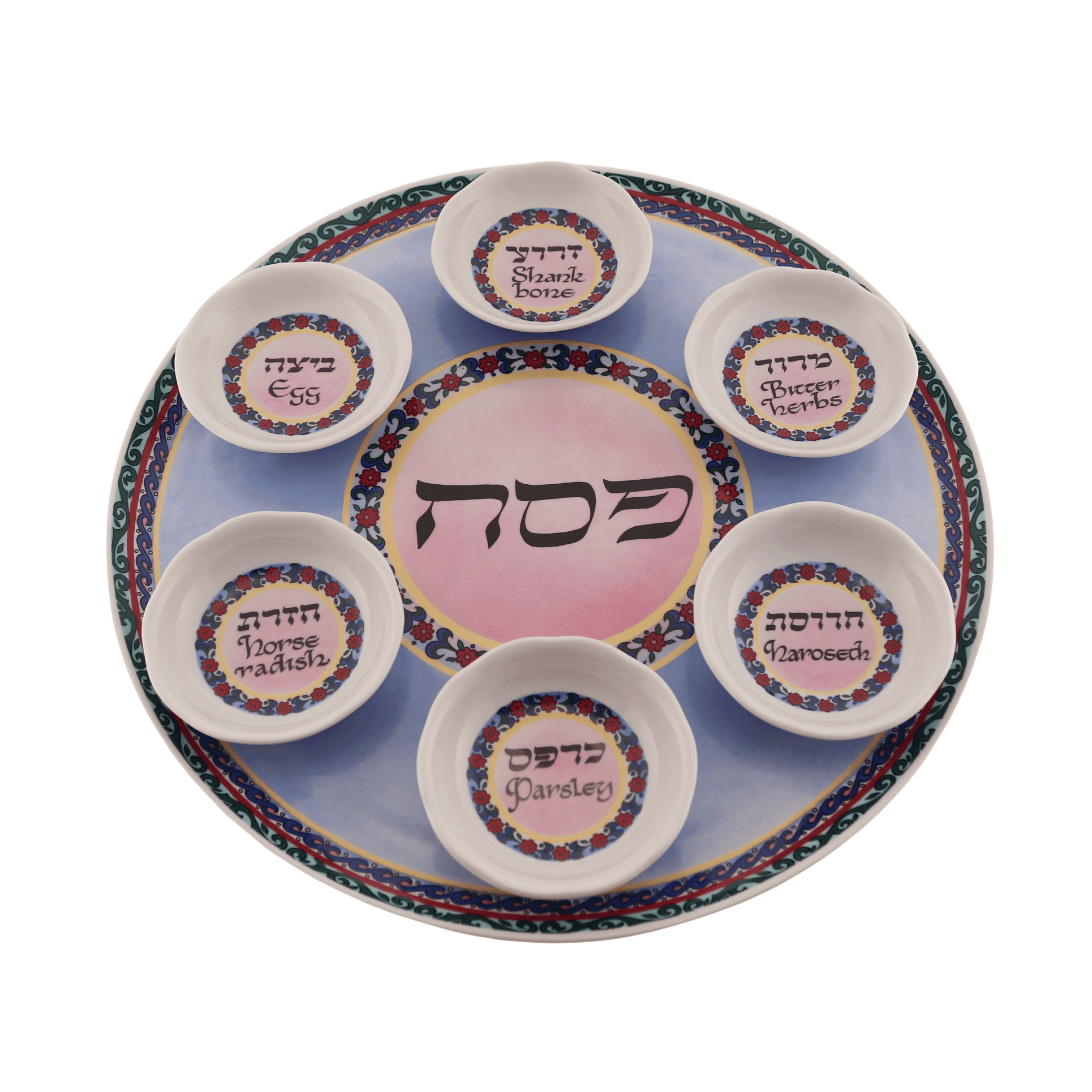 Pink and blue seder plate with a floral design and green trim around the edges