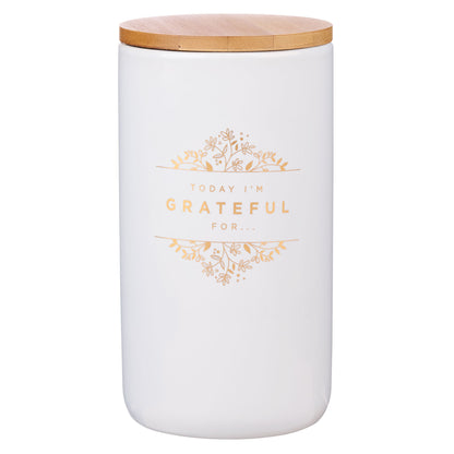 White jar with a wooden lid and 'Today I'm Grateful For' text in gold.