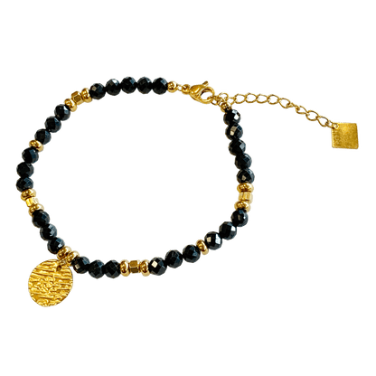 Onyx stone bracelet interspersed with gold-plated beads with a gold-plated charm 