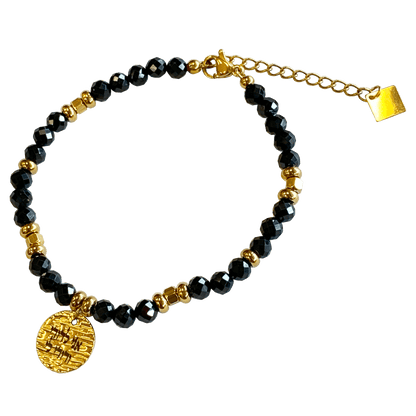 Onyx stone bracelet interspersed with gold-plated beads with a gold-plated 
charm that says “I Am My Beloveds” 