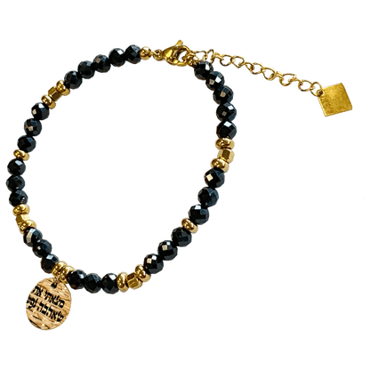 Onyx stone bracelet interspersed with gold-plated beads with a gold-plated charm that says “I Found Him Whom My Soul Loveth” 