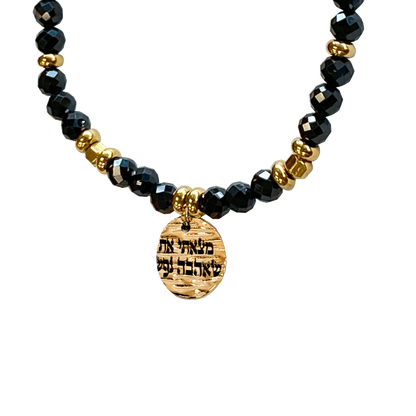 Onyx stone bracelet interspersed with gold-plated beads with a gold-plated charm that says “I Found Him Whom My Soul Loveth” 