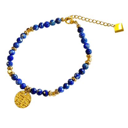 Lapis stone bracelet interspersed with gold-plated beads with a gold-plated charm 