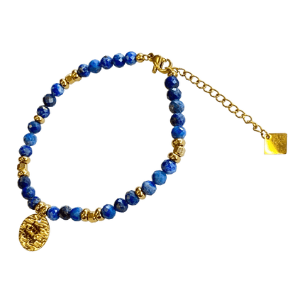 Lapis stone bracelet interspersed with gold-plated beads with a gold-plated Shema charm 