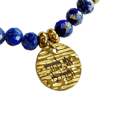 Lapis stone bracelet interspersed with gold-plated beads with a gold-plated 
charm that says “I Am My Beloveds” 