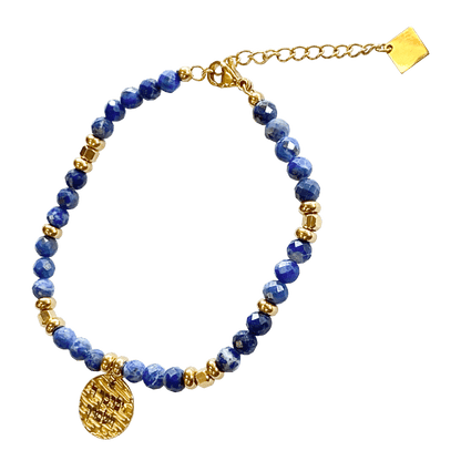 Lapis stone bracelet interspersed with gold-plated beads with a gold-plated charm that says “May God Bless You & Keep You” 