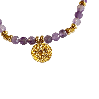 Amethyst stone bracelet interspersed with gold-plated beads with a gold-plated charm that says “I Am My Beloveds” 