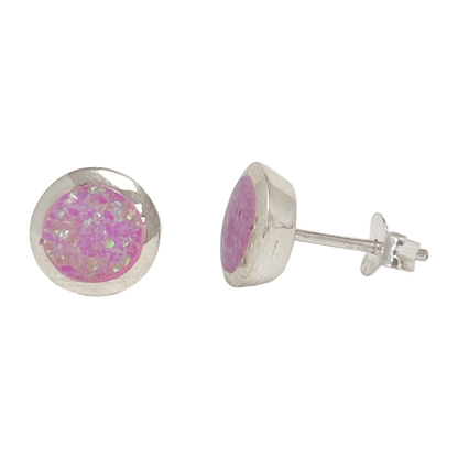 Synthetic pink opal round stud earrings set in a polished metal base