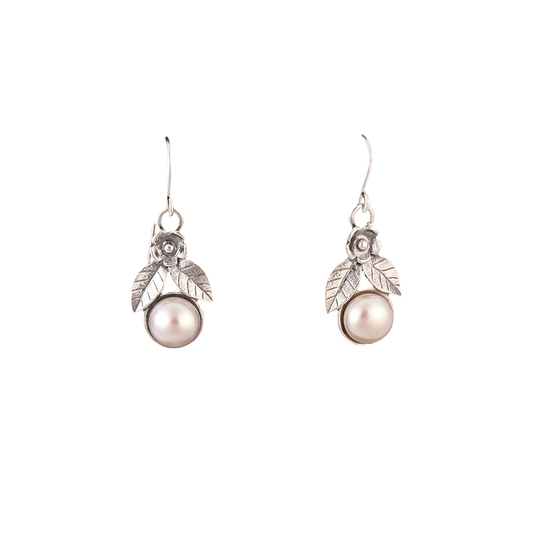 Dangle pearl earrings with sterling silver flower detail at the top