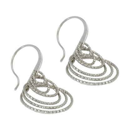 Sterling silver dangle earrings with multiple diamond-cut hoops