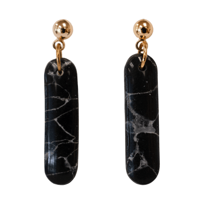 Handcrafted black stud earrings made of marbled polymer clay with gold hardware