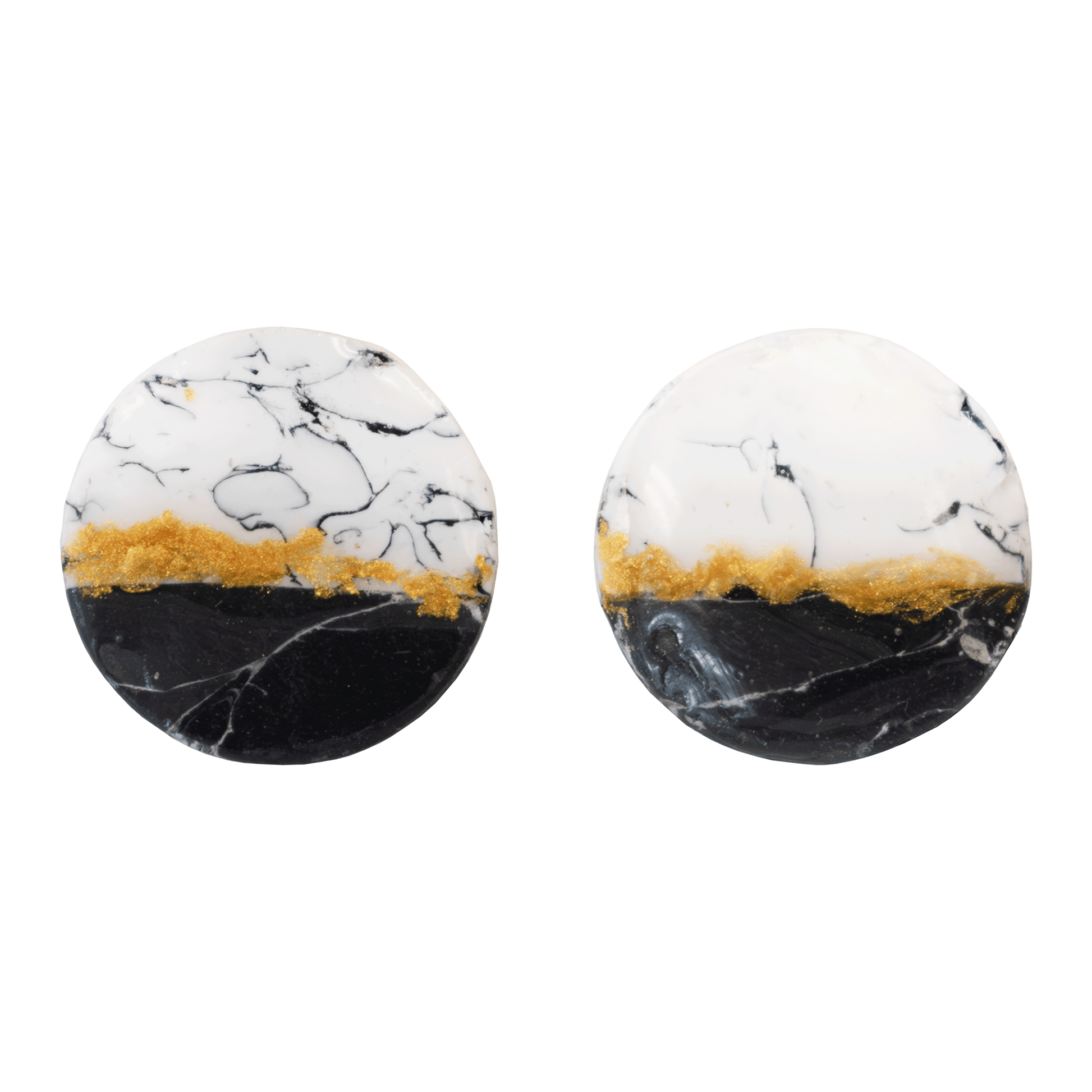 Circular white and black stud earrings made of marbled polymer clay