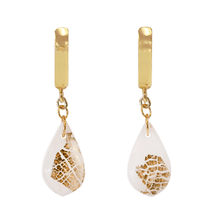 Gold-plated hoop earrings with a white polymer clay teardrop accented with gold foil suspended from the hoop