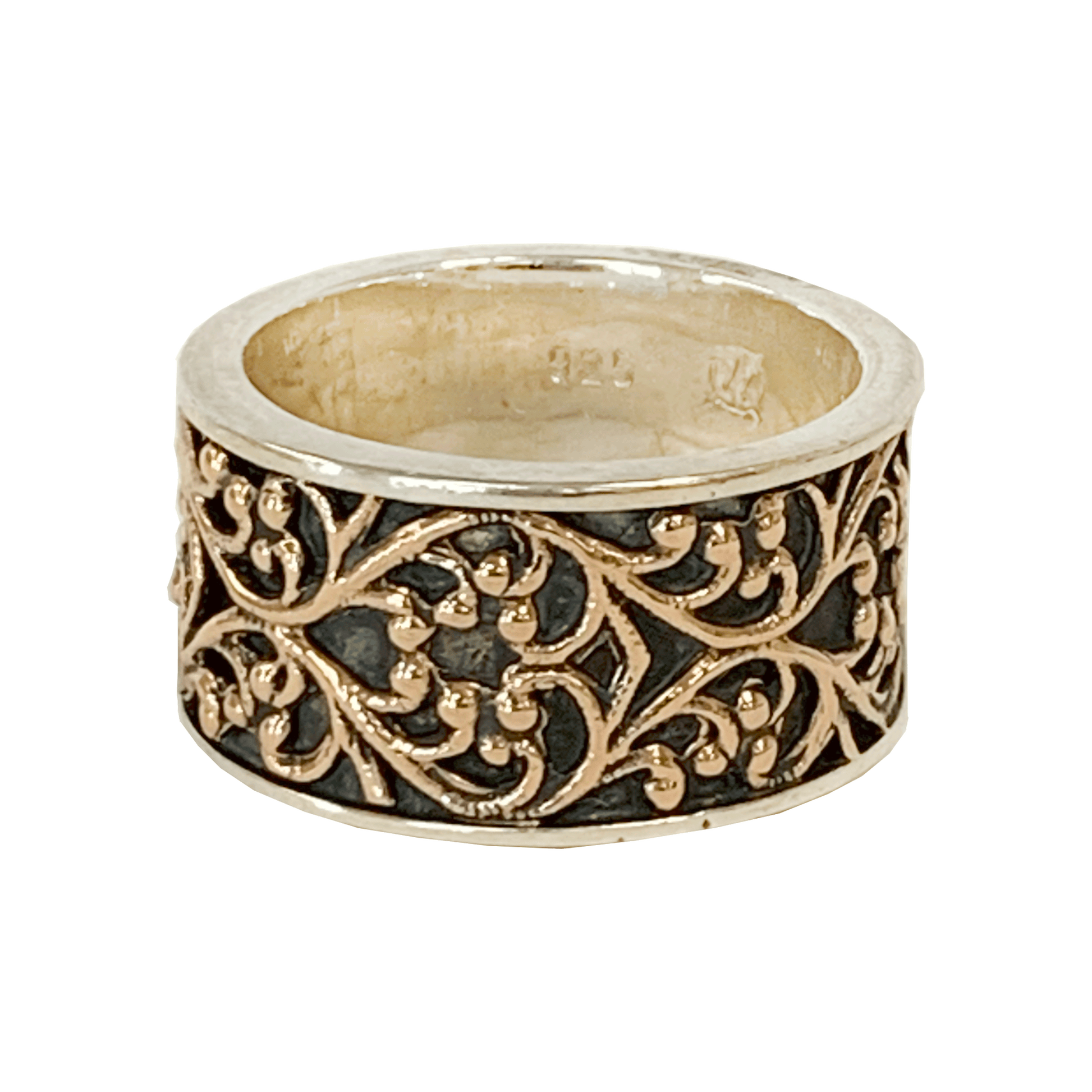 Sterling silver wide ring with a 14-karat rose gold filigree pattern